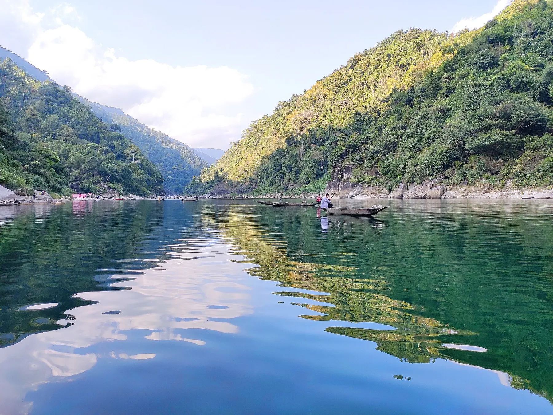 Emerald Umngot River between forested hills, Meghalaya