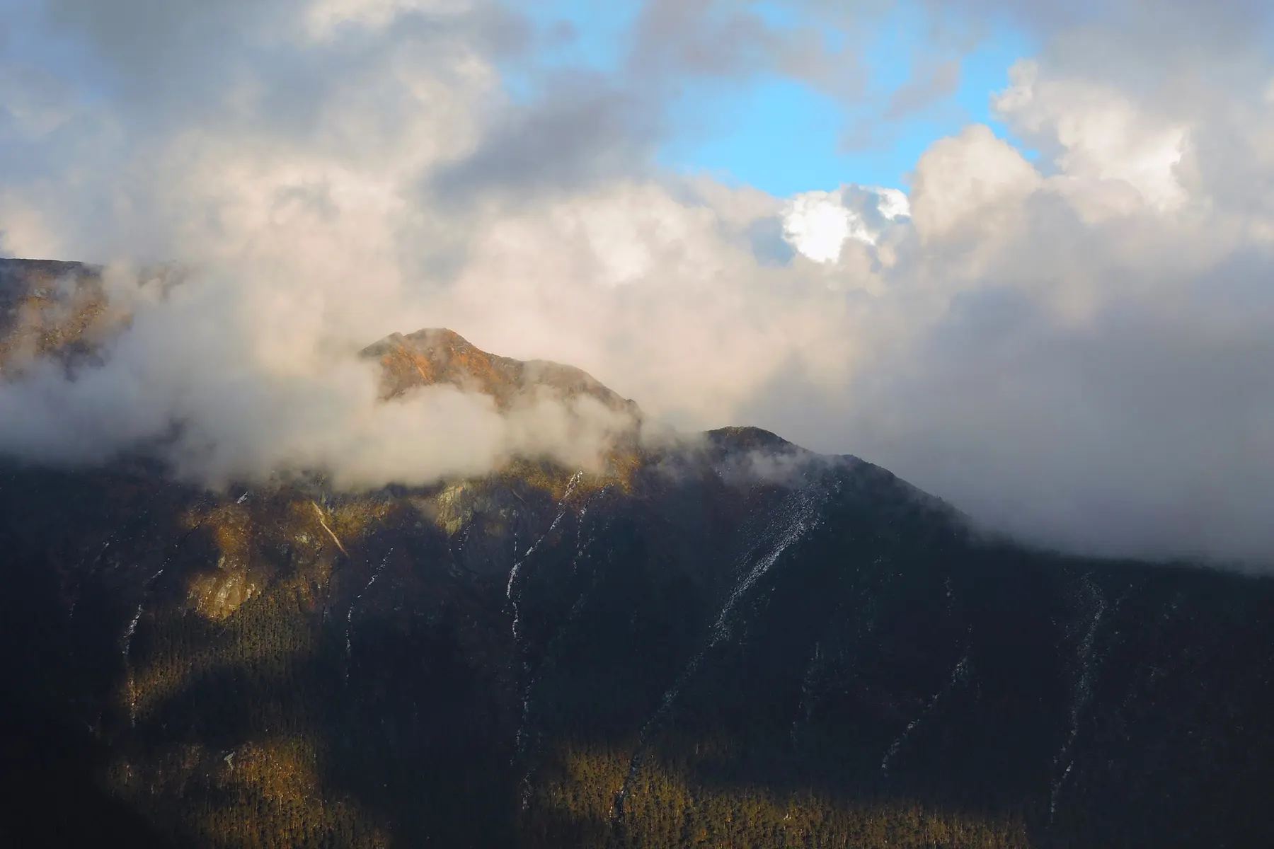 Clouds and light over the slopes of Sela Pass