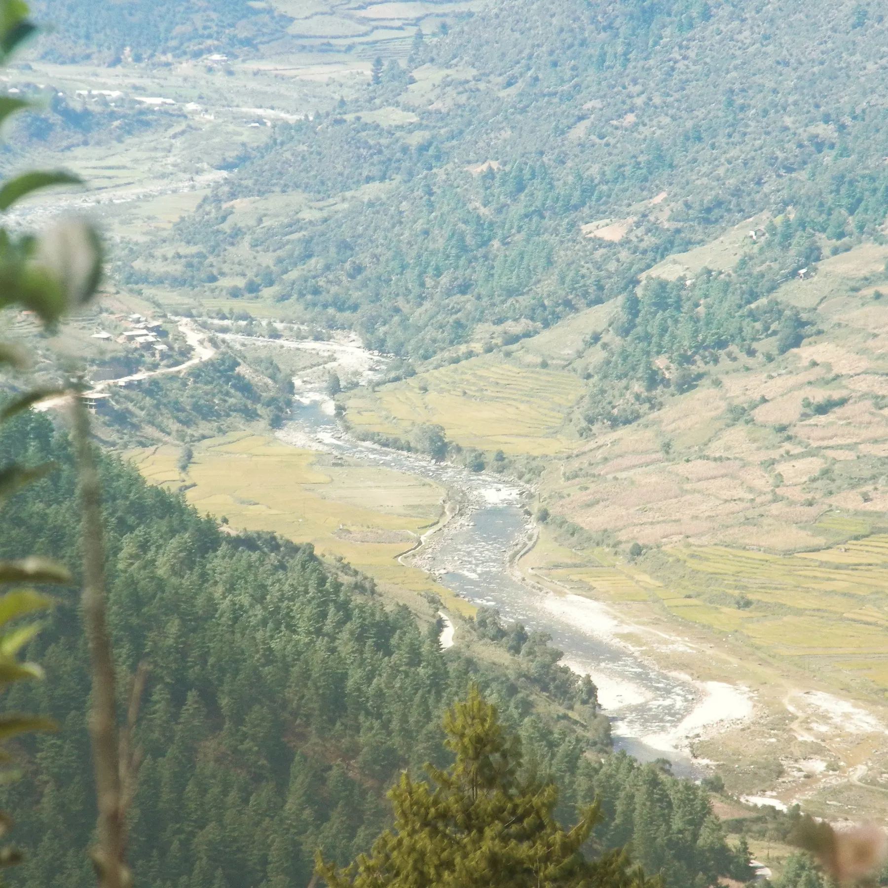 The Sangti river winding through the valley